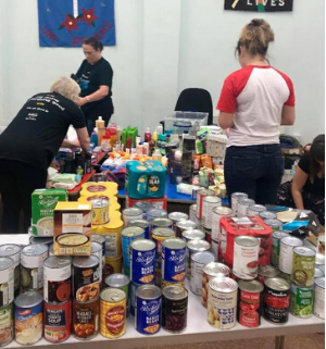 M&S volunteers busy at work sorting through food.