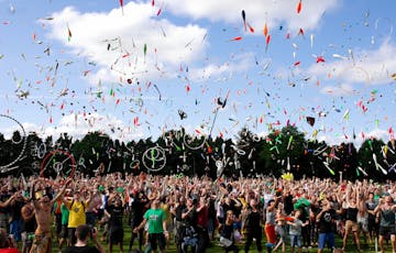people at a festival ticker tape